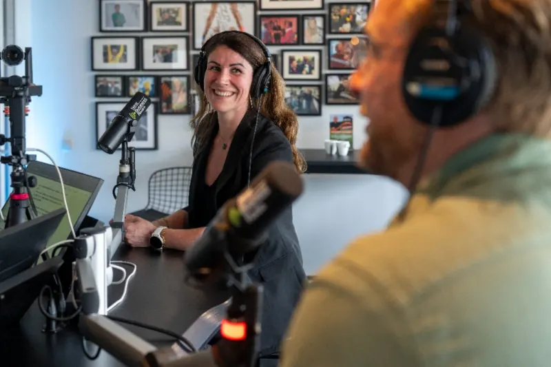 Serena Smolders listening as Stefan Sprenkels of Q-Feeds speaks in the studio.