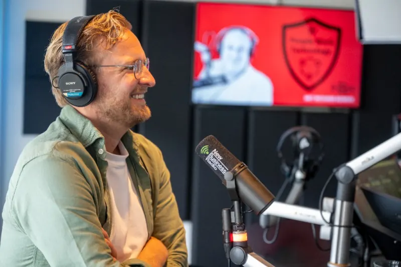 Stefan Sprenkels of Q-Feeds smiling during the De Staat van Security recording.